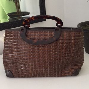 Maxx NY clutch. Tortoise handles-leather exterior